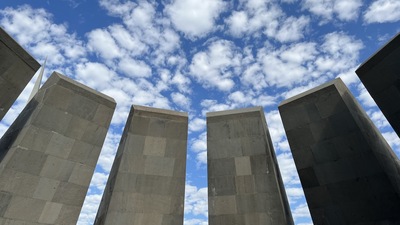Concrete monoliths against a blue sky
